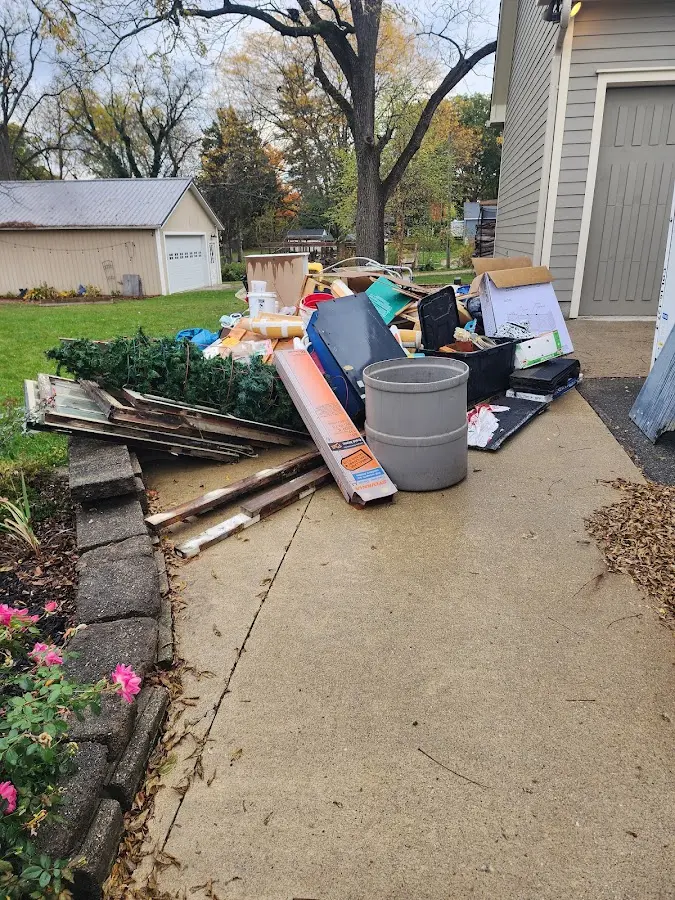 Dumpster being loaded with debris for 3 Yard Dumpster Rental in Tara Hills